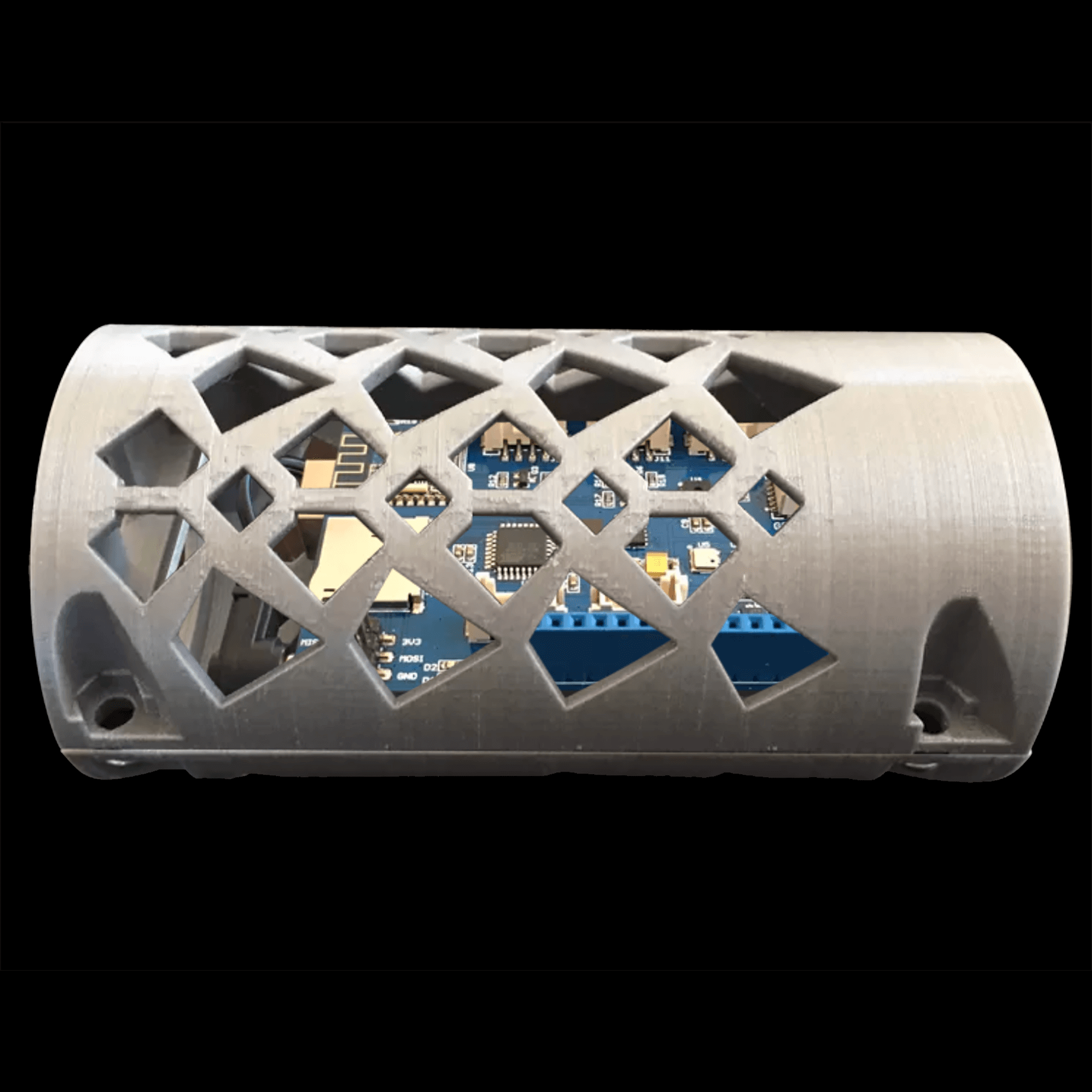 The 3D-printed CanSat enclosure. It has holes in it for aerodynamics. Through the holes, you can see the Arduino microcontroller with the specialized circuit board built for attaching the different sensors without soldering.